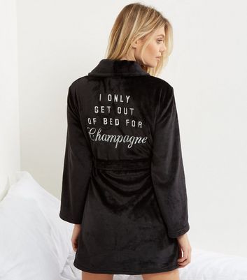 http://media.newlookassets.com/i/newlook/504872901/womens/nightwear/dressing-gowns/black-champage-slogan-back-dressing-gown/